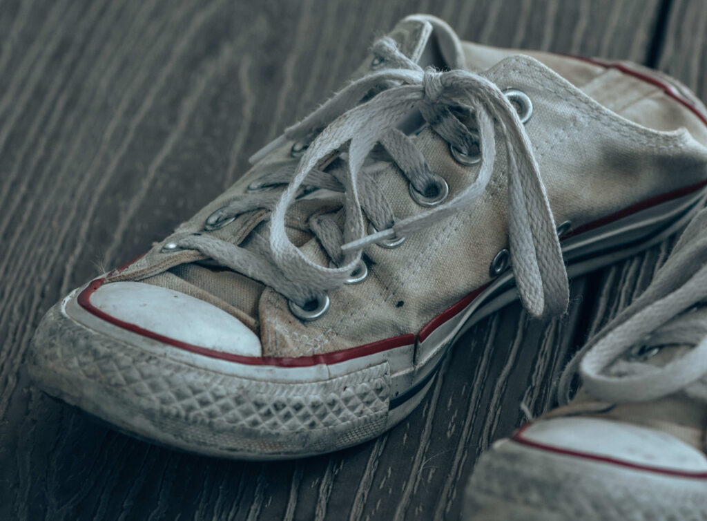 Worn out tennis shoes